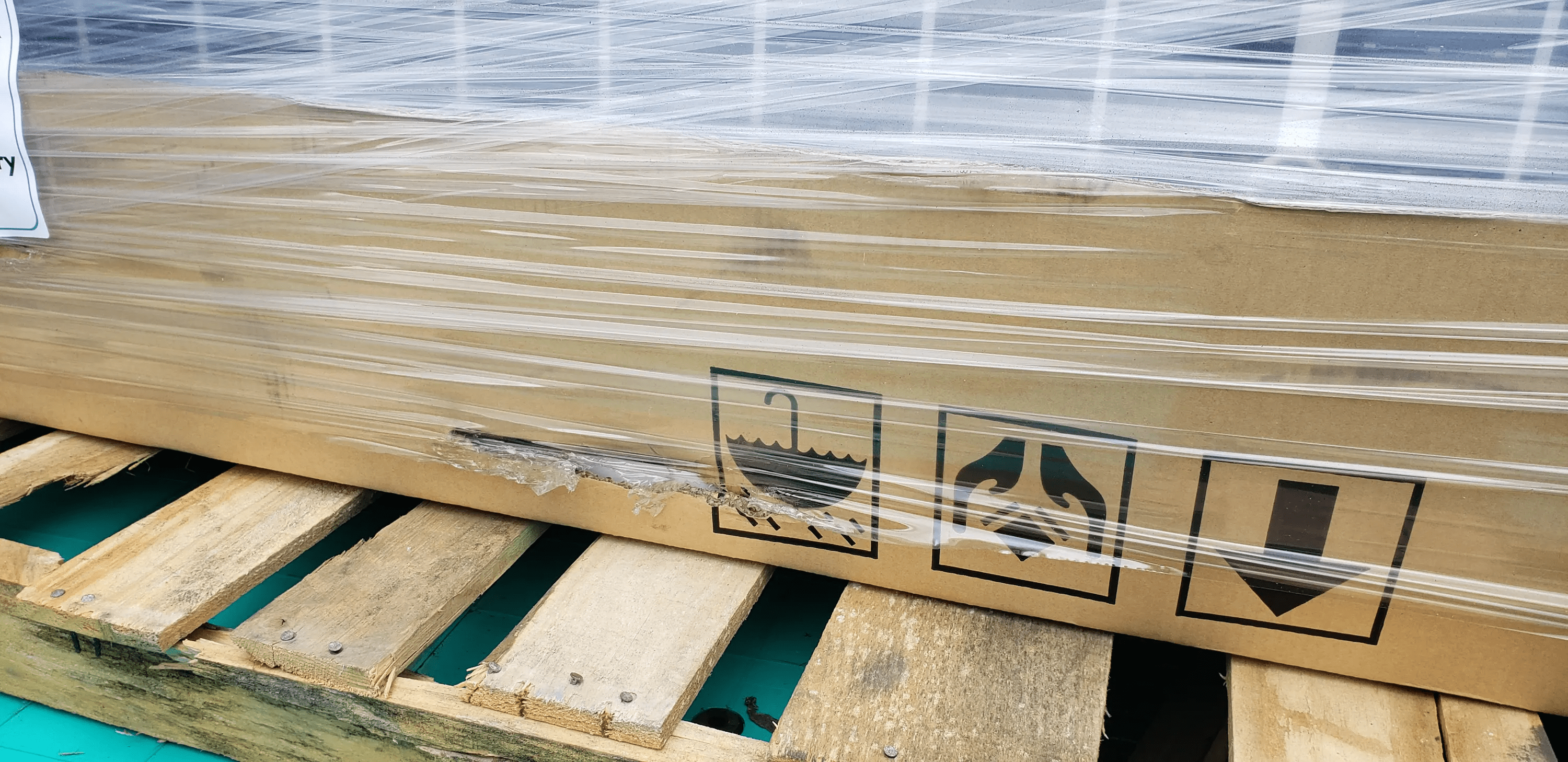 Example of rips, tears, scuffing to the exterior packaging
